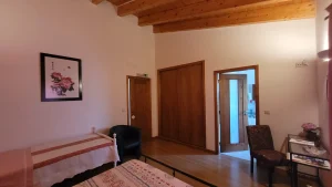 Wooden wardrobe inside Papoila Room – storage for guests at Madrugada Turismo Rural.